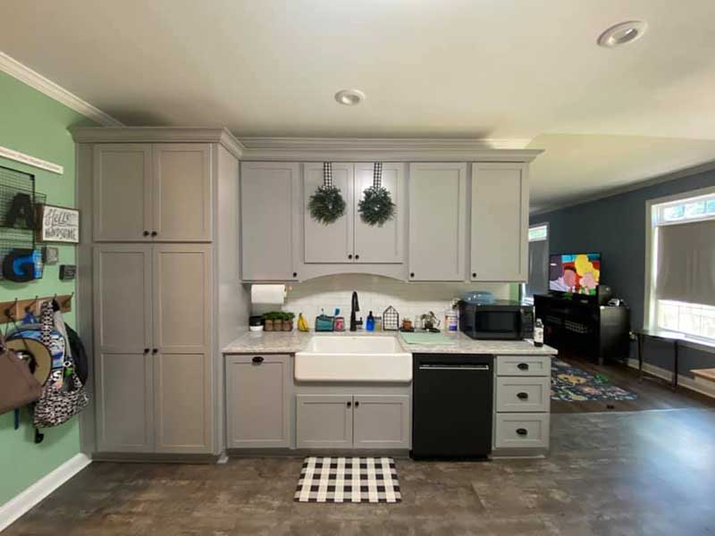 A small, efficient kitchen with smart storage solutions. This space maximizes functionality in a limited area.