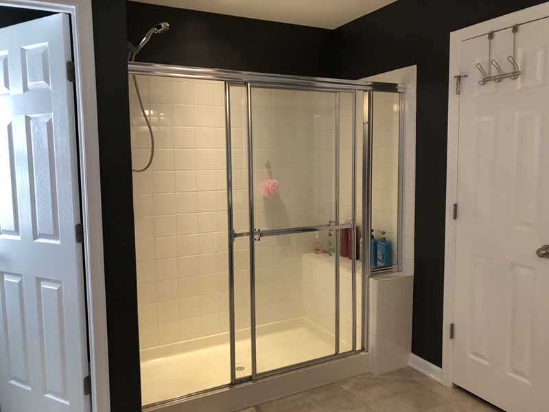 An old sliding glass-door shower.