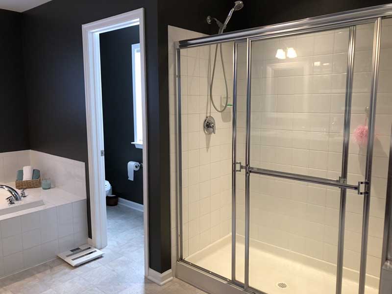 A large bathroom with old vinyl flooring