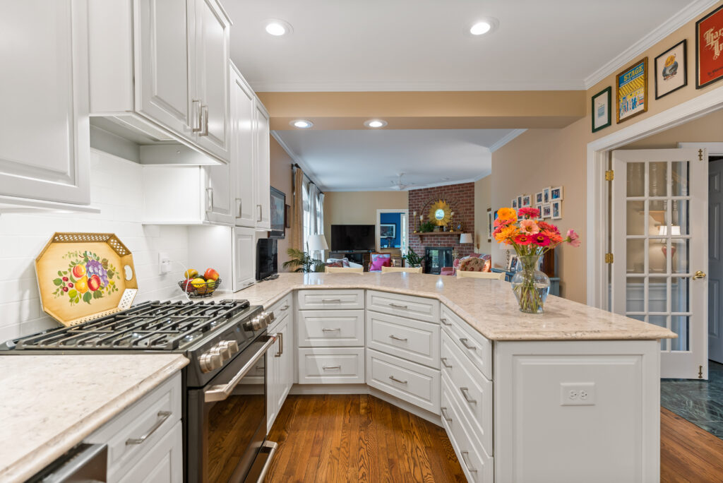 white kitchen island with quartz countertops