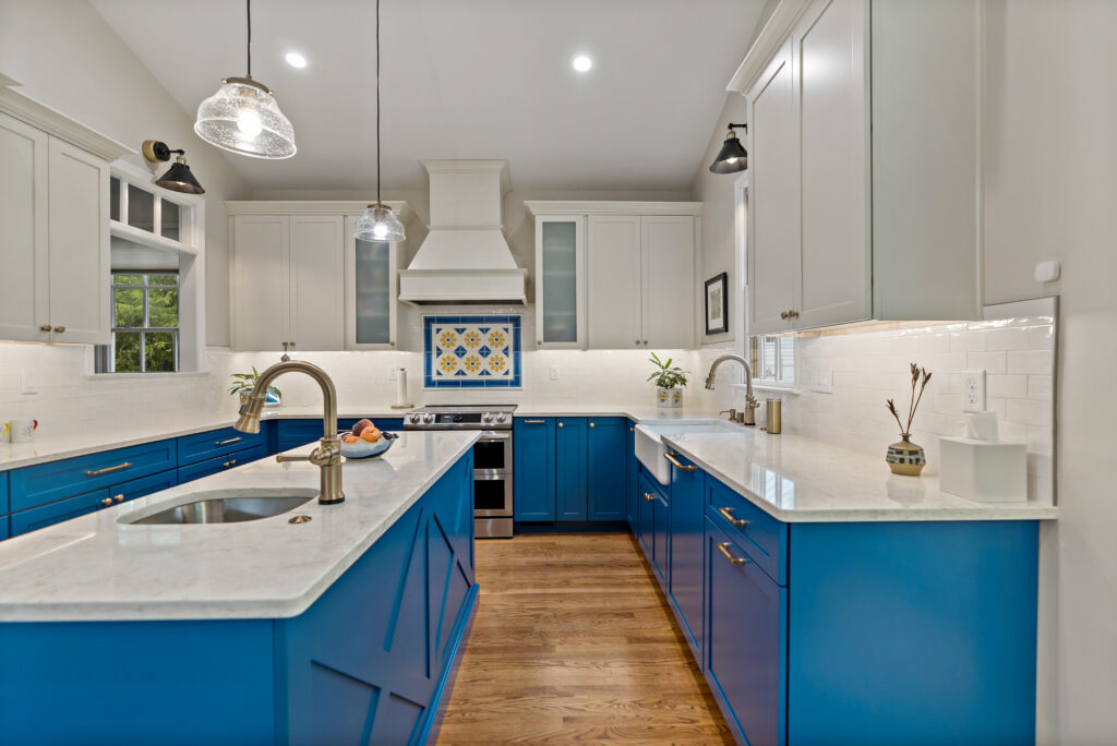 blue kitchen cabinets and hardwood floor