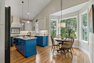 blue custom cabinets with hardwood flooring