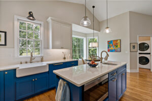 blue kitchen cabinets with quartz island countertop