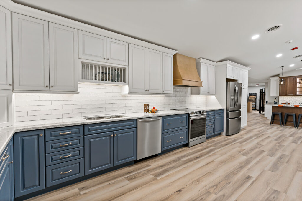 Showroom kitchen with navy lower cabinets and white uppers